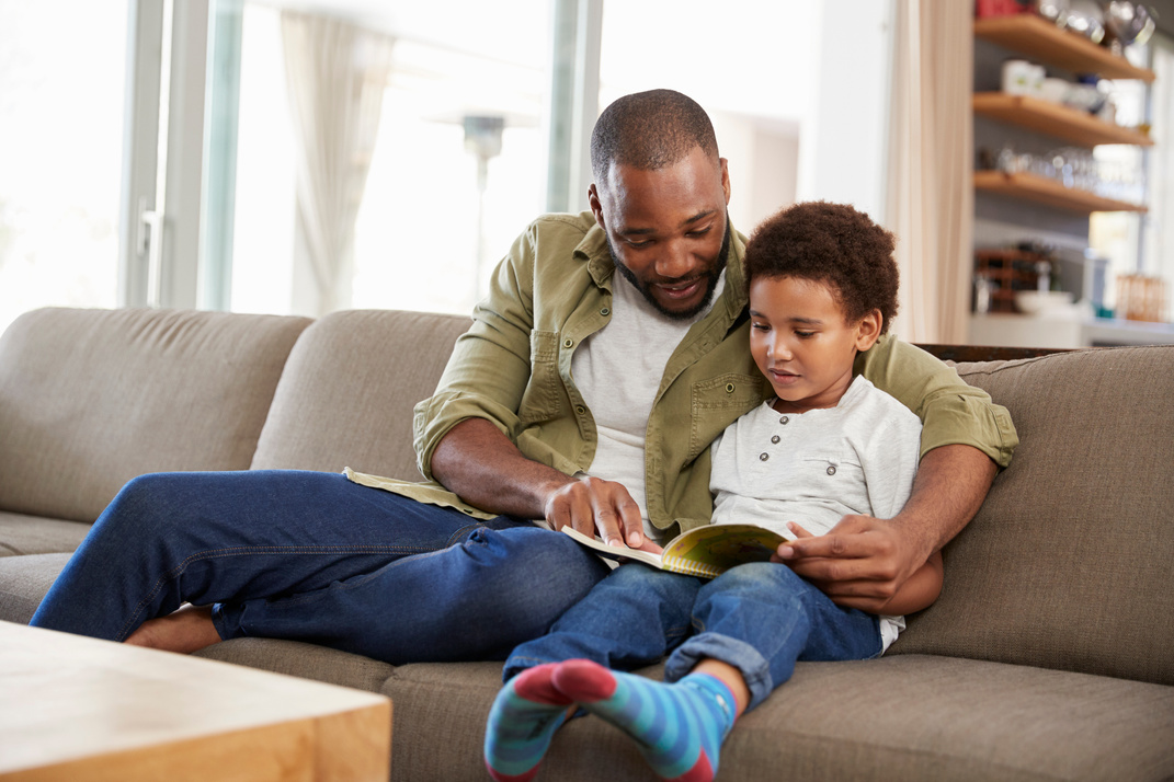 Father and Son Reading Together